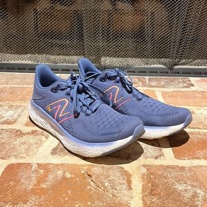 New Balance W1070L 12, Women’s size 8.5 B US Blue w/pink & orange logo